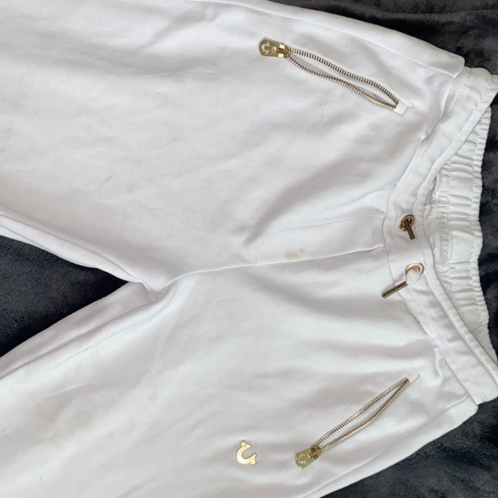 White true religion sweatpants with gold detailing